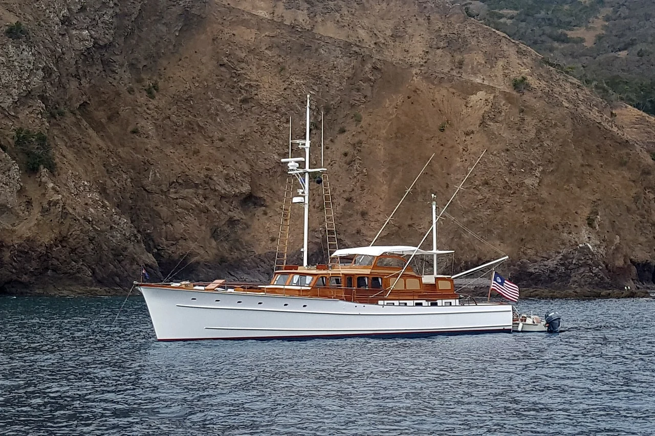 Motor yacht cruising along the coast